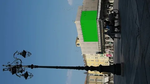 Vertical view of a city square with two billboards advertising in green screen Stock Footage 106861127