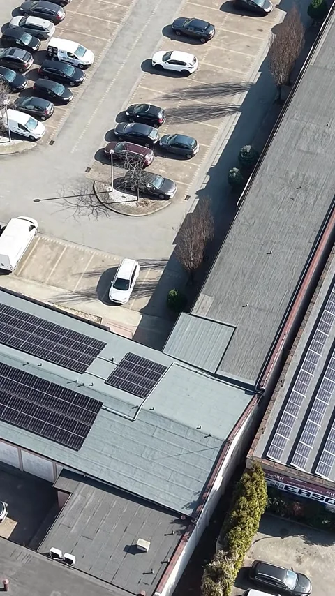Vertical view. Clean energy installation on large rural storage building Stock Footage 348631192