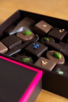 Vertical view of a close-up of a full open chocolate box Stock Photos