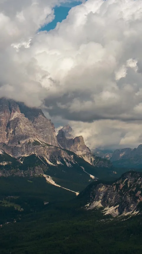 Vertical View of Clouds Moving Above Valley and Cortina D'Ampezzo, Landscape of Stock Footage 342078956