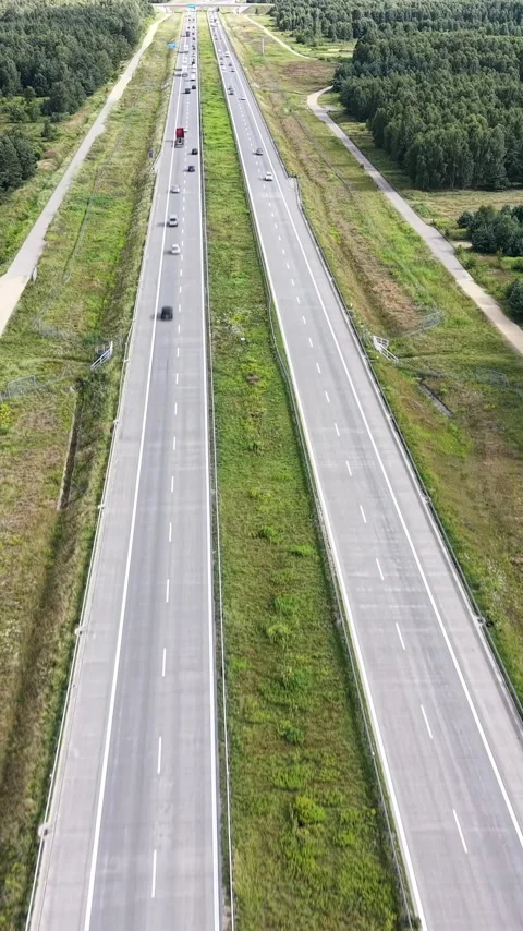 Vertical view. Commuting traffic on rural European Union highway Video stock 348630818