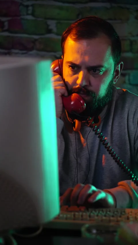 Vertical View, Computer Technician From 1980's Answering Phone Call in Front of 스톡 동영상 301847145