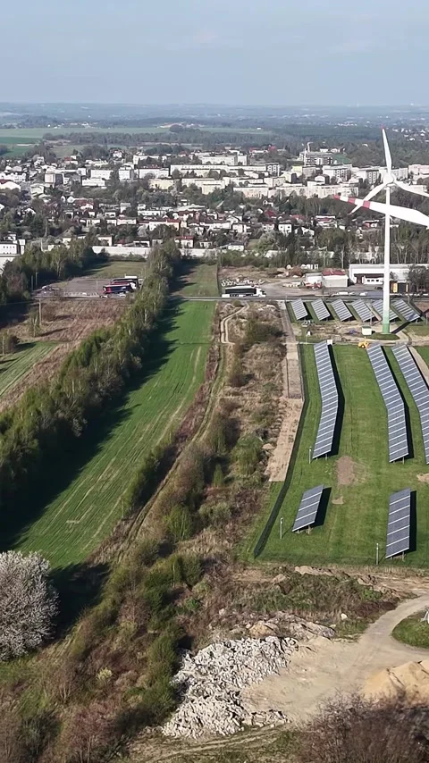 Vertical view. Construction and installation of wind and solar energy farm Stock Footage 348631298