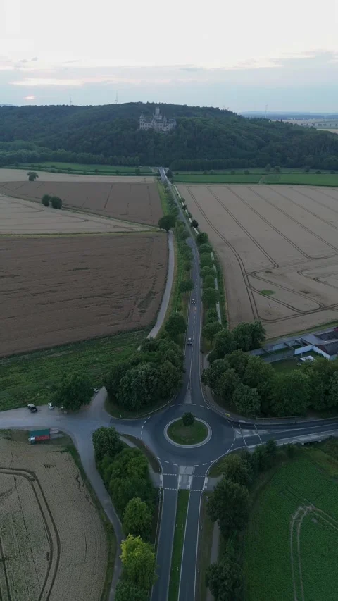 Vertical view of a country roundabout and fields in rural Germany 스톡 동영상 340159896