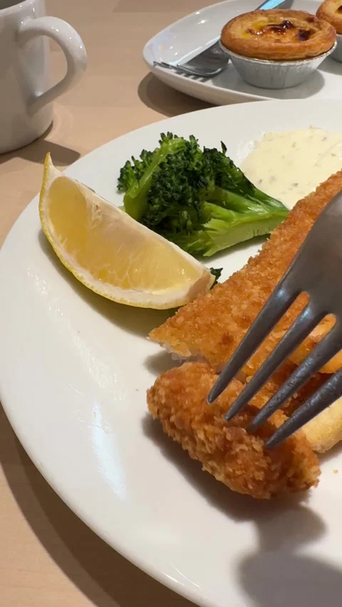 Vertical View Of Cutting Fried Fish Steak With Fork And Dipping In White Cream S Stock Footage 346596683