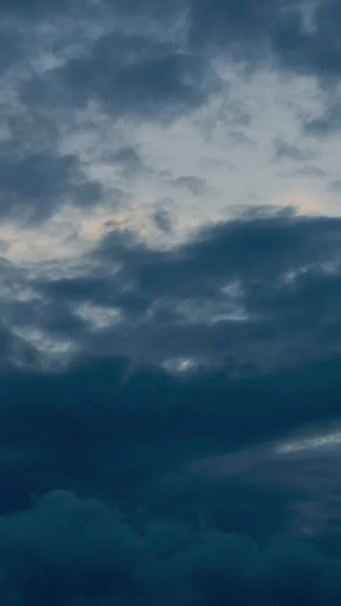 Vertical view of Dark stormy clouds moving across the sky Stock Footage 334102279