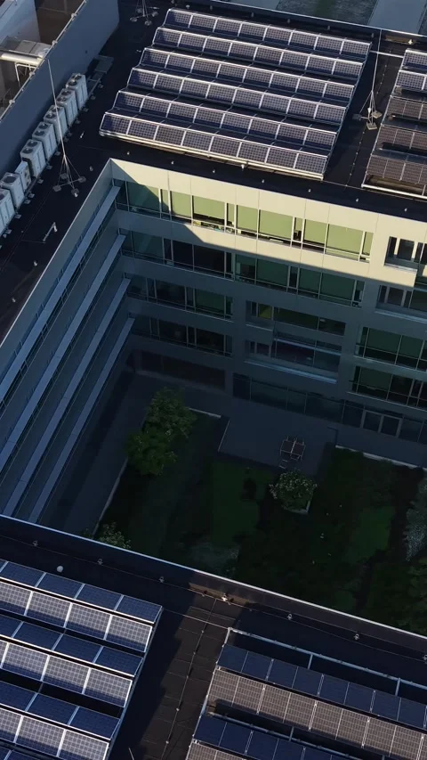 Vertical view. Data center buildings surrounded by green landscape Video stock 348630602