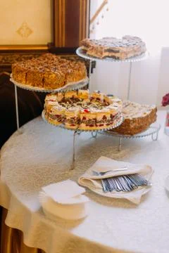 Vertical view of the different cakes on the desset stands. Stock Photos