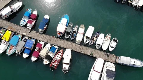 Vertical view different multicoloured boats moor in sea bay Video stock 103181798