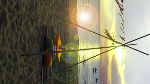 Vertical view of dinner table with bokeh lens flare on sunset sky beach Video stock 155437777