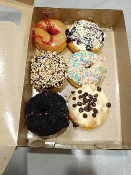 Vertical view of donuts in paper box Stock Photos