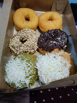 Vertical view of donuts in paper box Stock Photos