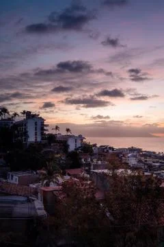 Vertical view of dramatic sunset over cityscape of Puerto Vallarta Jalisco .. Stock Photos