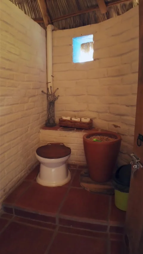 Vertical View Of A Dry Bathroom Design Inside A Cob House. POV Shot Stock Footage 294696389