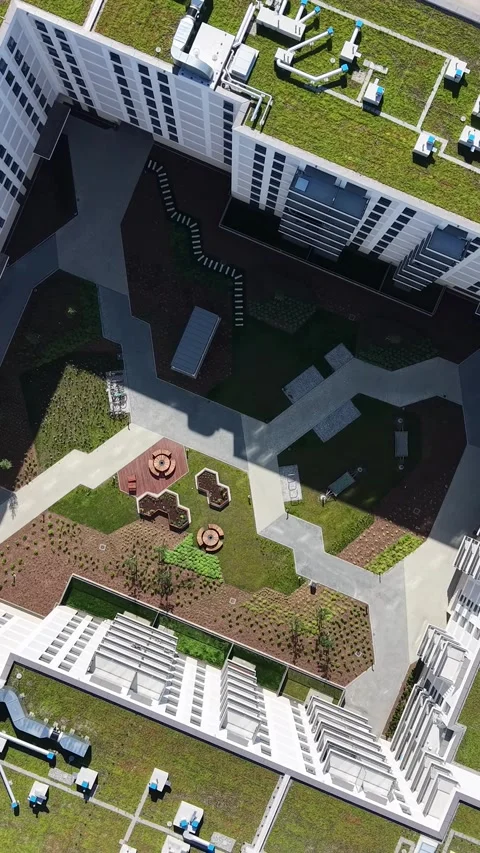 Vertical view. Eco friendly green roof on multi story apartment building Stock Footage 348630800