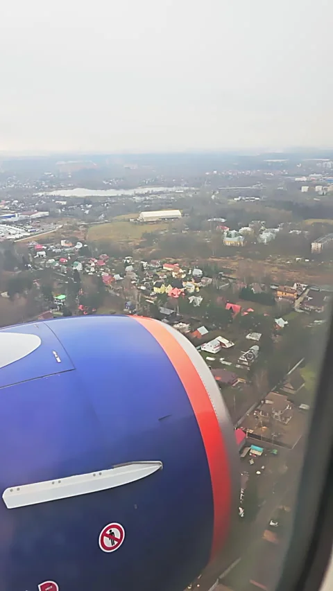 Vertical. View from the ejector of a flying passenger plane Stock-Footage 267404838