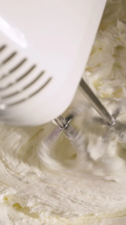 Vertical View Of An Electric Hand Mixer Working In A Kitchen. Close-up Shot Stock Footage 329004415