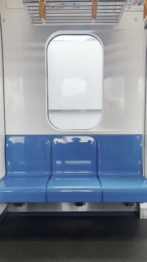Vertical View of Empty Blue Seats Inside MRT Jakarta Train Stock Footage 336979643