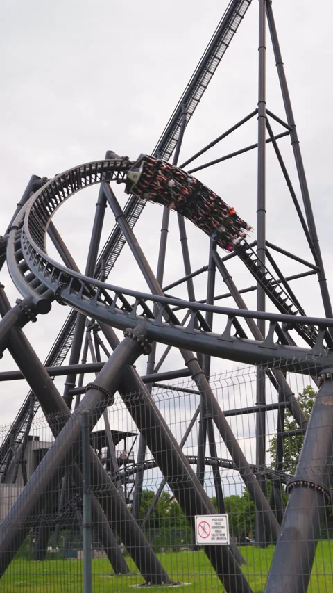 Vertical View of Fast Rollercoaster Moving on Tracks at Energylandia Amusement Stock Footage 337776204