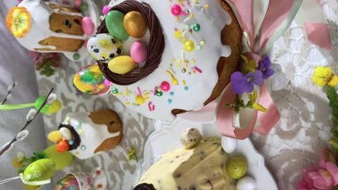 Vertical view. Festive Easter table setting. Easter cake, Easter Eggs, Flow.. Stock Footage 234194998