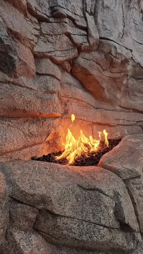 Vertical View of Flames in Natural Stone Fire Feature Stock Footage 312532203