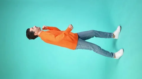 Vertical view of funky nerd guy season disco free-time dance jump have fun Video stock 162903236