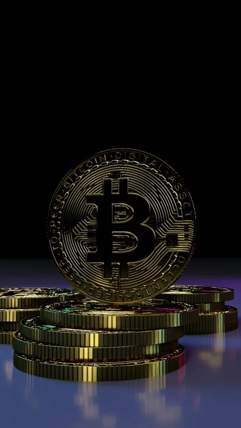 Vertical View of Golden Bitcoin Standing on Coin Stacks 動画素材 346369330