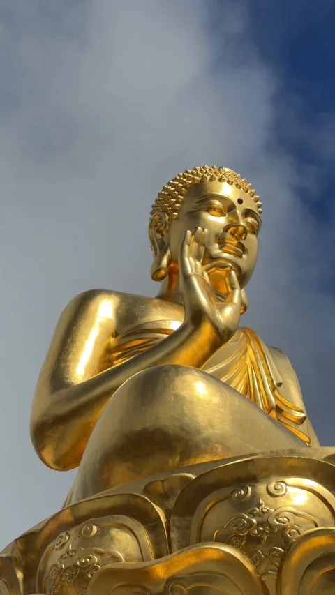 Vertical view of a golden Buddha statue with Vitarka mudra as a Buddhist flag 스톡 동영상 327460337
