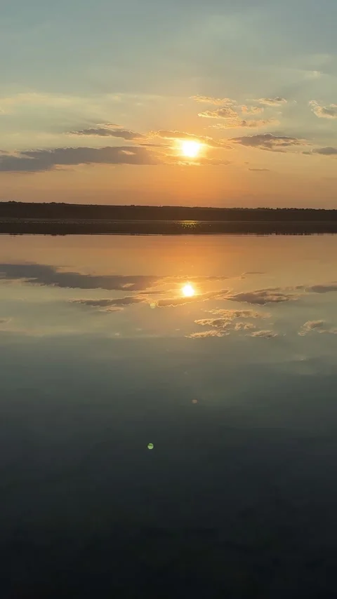 Vertical View of Golden Sunset Reflection over Salt Estuary Stock-Footage 342131790