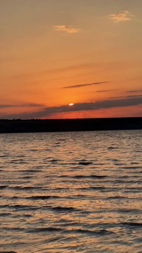 Vertical View of Golden Sunset Sunlight on Water Waves Stock-Footage 342135348