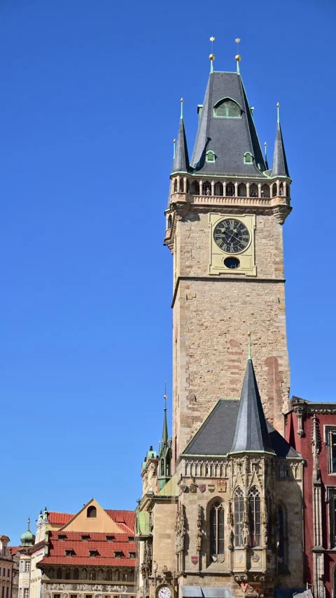 Vertical view of the Gothic Old Town Hall Tower with its clock above red Stock Footage 342278267