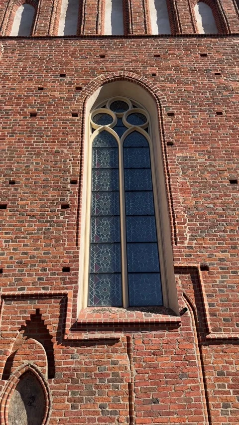 Vertical view of gothic stained glass window in church Stock Footage 317500267