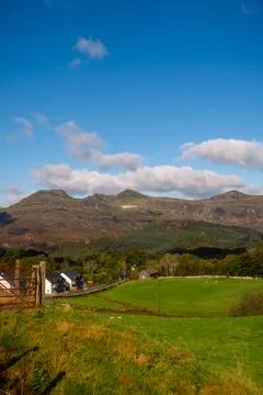 Vertical View of Green Fields and Mountain Peaks under Blue Sky, Snowdonia,.. Stock Photos