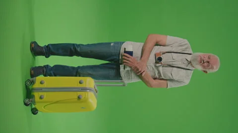 Vertical View. Green Screen.An Old Man Tourist is Standing at the Airport. Stock Footage 243467120