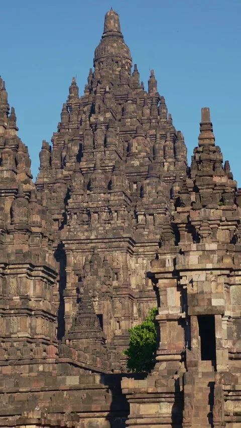Vertical view highlights clustered Prambanan Temple towers, ornate entrance.. Stock Footage 341545446