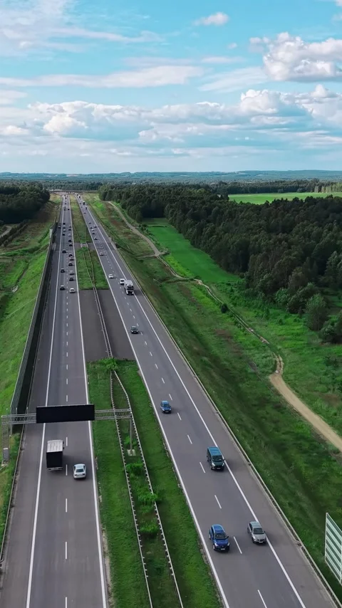 Vertical view. Highway aerial view Ideal for logistics, travel, automotive, and Stock Footage 348630840