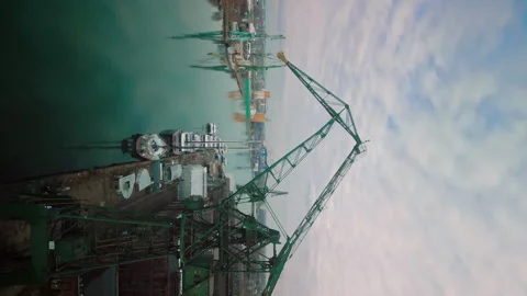 Vertical View of the Huge Towering Cranes in Massive and Dynamic Gdansk Port. 動画素材 252281935