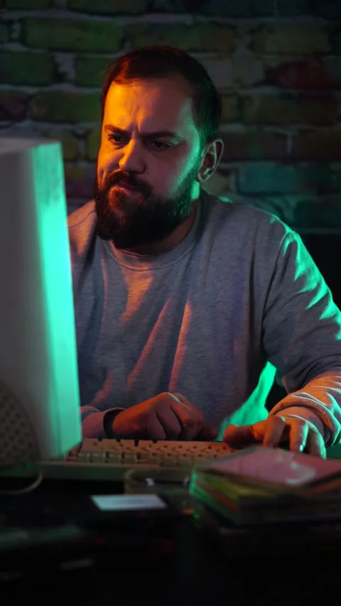 Vertical View, IT Guy From 1990's Having Problem, Looking at Flickering CRT Stock Footage 302473388