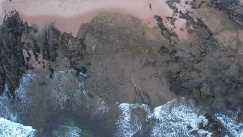 Vertical view of Itapuã beach with waves washing reefs Stock Footage 301373891