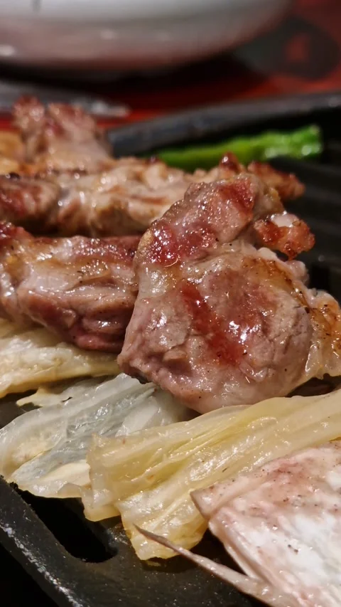 Vertical View of Korean BBQ, Fried Meat on Cabbage, Close Up Stock Footage 337456368