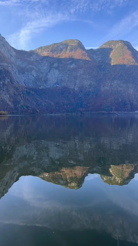 Vertical view of lake waters. Fresh air, blue sky along the horizon, mountains Stock Footage 292795388