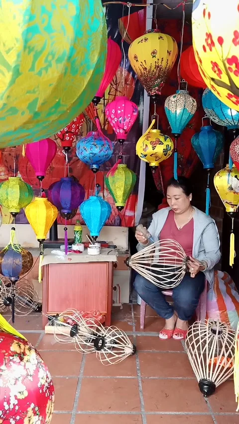Vertical view of lanterns in the making, Hoi An old town, Vietnam Stock Footage 248000338