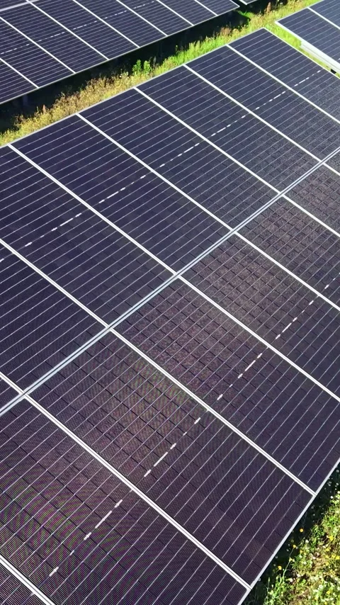 Vertical view. Large Renewable Energy Facility with Solar Panel Rows Stock Footage 348631138