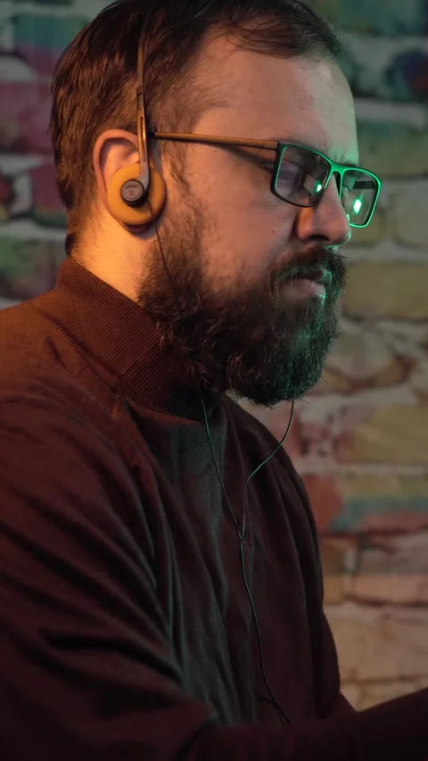 Vertical View, Man From 1980's With Glasses and Headphones Working on Desktop Stock Footage 306752807