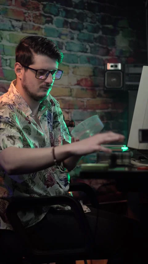 Vertical View of Man in Front of Desktop Computer From 1990's Taking Out DVD Stock Footage 306056578