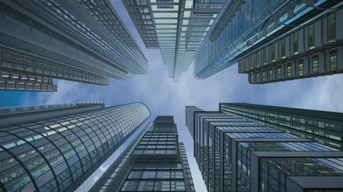 Vertical view of modern skyscrapers in business district against blue sky Stock Footage