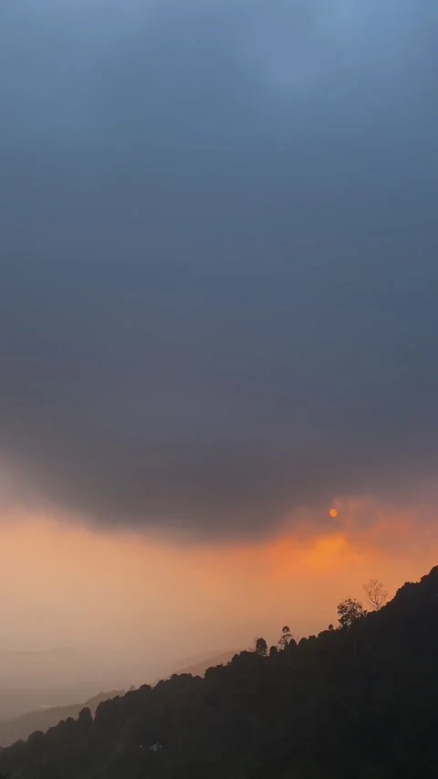 Vertical View Of Moody Sunset Over Mountain Ridge In Bali Video stock 342266090