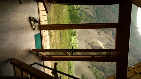 Vertical view of mountain in full wall panoramic window. triangular cottages Stock Footage 201306418