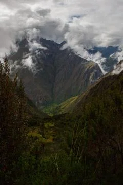 Vertical view of the mountains and the clouds. Stock Photos