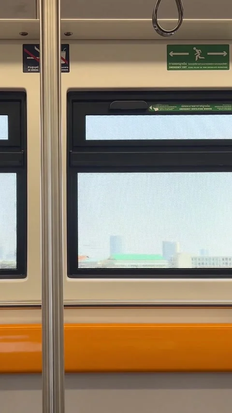 Vertical View of Moving Metro Train Window and City Skyline Vídeos de archivo 329740925